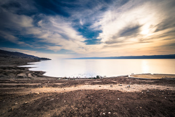 Dead Sea - October 05, 2018: Tourists bathing in the salty Dead Sea, Jordan