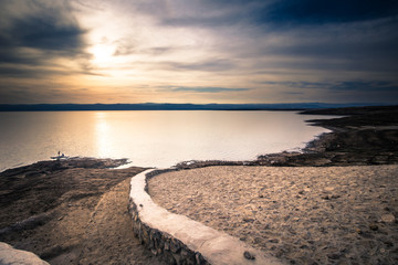Dead Sea - October 05, 2018: Tourists bathing in the salty Dead Sea, Jordan