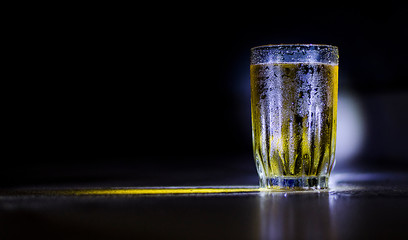 glass of whisky on black background