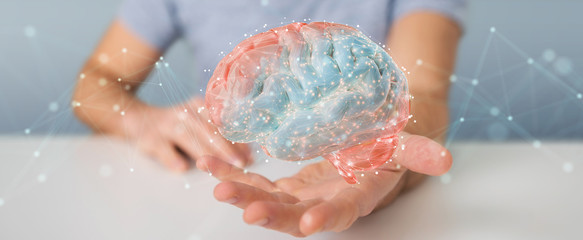 Fototapeta premium Businessman using digital 3D projection of a human brain 3D rendering