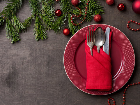 Holiday Serving Red Plate With Fork,spoon And Knife At Wood Background