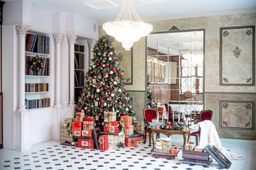 Christmas living room with a christmas tree and presents under it