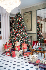 Christmas living room with a christmas tree and presents under it