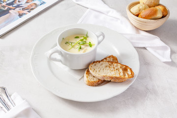 Cheese soup in a plate on the table