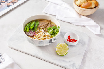 Asian soup in a plate on the table