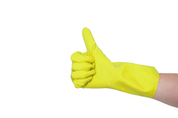 Yellow glove for cleaning on a female hand shows thumb up. The concept of cleanliness.