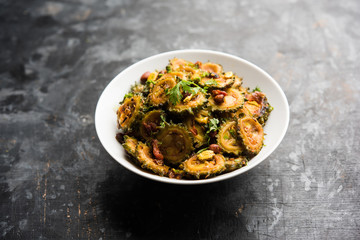 Cooked bitter Melon/gourd or Karela Sabzi served in a bowl. Scientific name of this healthy...