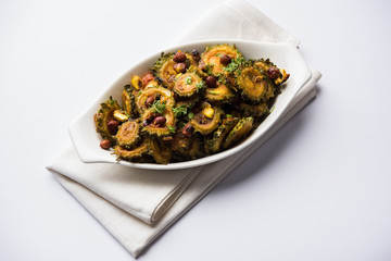Cooked bitter Melon/gourd or Karela Sabzi served in a bowl. Scientific name of this healthy...