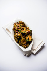 Cooked bitter Melon/gourd or Karela Sabzi served in a bowl. Scientific name of this healthy...