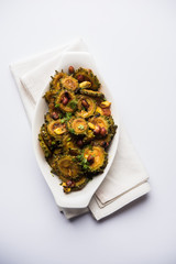 Cooked bitter Melon/gourd or Karela Sabzi served in a bowl. Scientific name of this healthy...