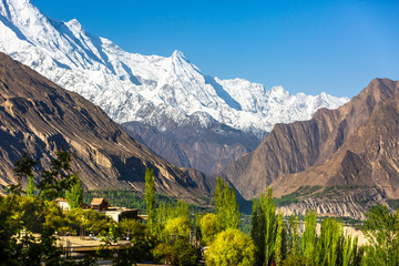 Scenic view of Hunza Valley in summer between the Karakoram Mountain range in Pakistan in the  morning. © kamonrat