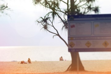 Tsunami warning sign Beach background the tourist Bright sunlight sky