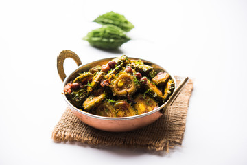 Cooked bitter Melon/gourd or Karela Sabzi served in a bowl. Scientific name of this healthy...
