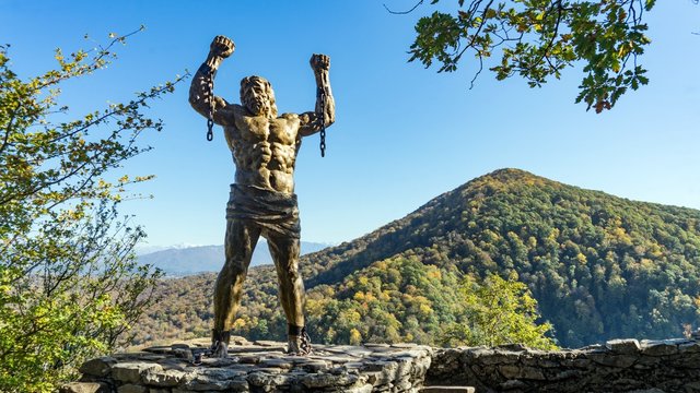 Prometheus sculpture on the backgroung of Ahun mountain, Sochi, Russia.