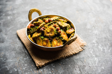 Cooked bitter Melon/gourd or Karela Sabzi served in a bowl. Scientific name of this healthy...