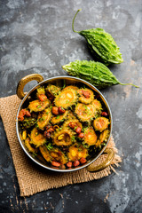 Cooked bitter Melon/gourd or Karela Sabzi served in a bowl. Scientific name of this healthy vegetable is Momordica charantia. selective focus