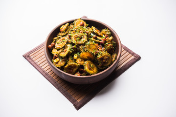 Cooked bitter Melon/gourd or Karela Sabzi served in a bowl. Scientific name of this healthy vegetable is Momordica charantia. selective focus