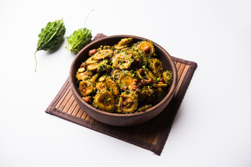 Cooked bitter Melon/gourd or Karela Sabzi served in a bowl. Scientific name of this healthy vegetable is Momordica charantia. selective focus