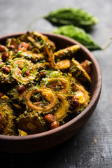 Cooked bitter Melon/gourd or Karela Sabzi served in a bowl. Scientific name of this healthy...