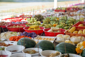 Asian believing, pray with incense and foods.