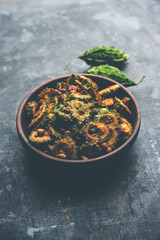 Cooked bitter Melon/gourd or Karela Sabzi served in a bowl. Scientific name of this healthy vegetable is Momordica charantia. selective focus