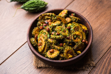 Cooked bitter Melon/gourd or Karela Sabzi served in a bowl. Scientific name of this healthy...