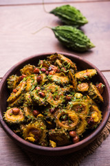 Cooked bitter Melon/gourd or Karela Sabzi served in a bowl. Scientific name of this healthy vegetable is Momordica charantia. selective focus