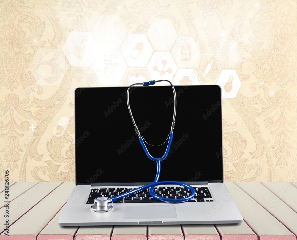 Sticker Laptop diagnosis with  stethoscope  on background