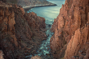 Fototapeta na wymiar Gorge where the water flows into the sea