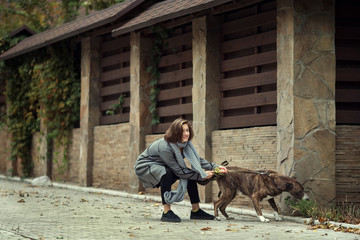 Girl walking with a dog
