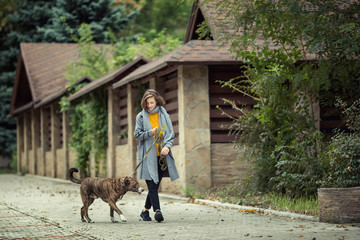 Girl walking with a dog