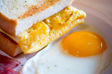 Close up toast and fried yolk yellow eggs.