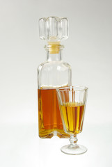 Strong drinks. Glass of cognac and bottles