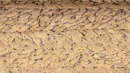 old antique clay wall, mud hut, cracked clay