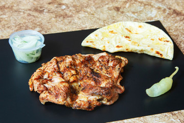Grilled meat, steak and vegetables on the table, fast food