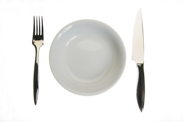 Empty plate, fork and knife isolated on white