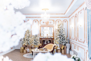 Christmas living room with a christmas tree and presents under it