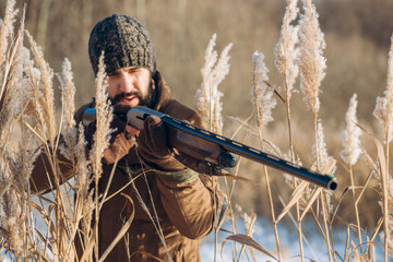 serious man is cincentrated on aiming at something. accurate shot. closeup photo