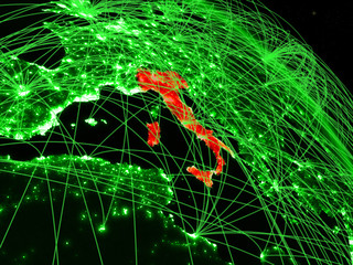 Italy from space on model of green planet Earth with network. Concept of green technology, connectivity and travel.