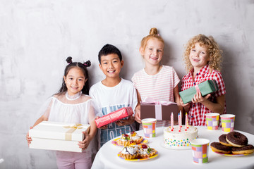 happy mixed raced kids or children on birthday party. close up photo. happiness, important event, childhood concept