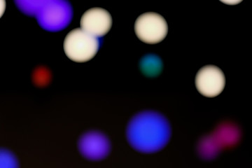dark background with light in out of focus.