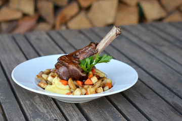 Lamb leg with potato puree and vegetables