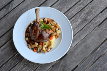Lamb leg with potato puree and vegetables