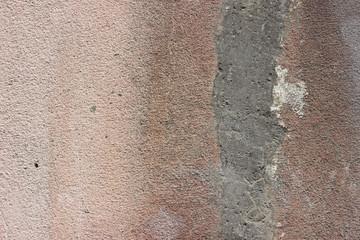 Facade wall grey gray red crack surface texture close up