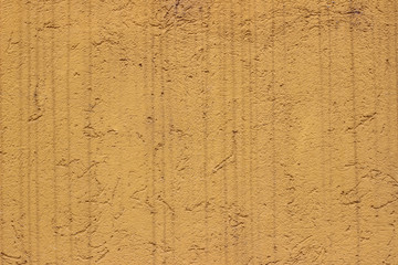 Facade wall yellow surface texture close up