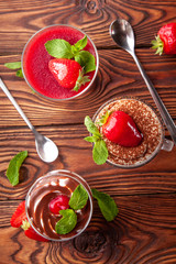 Top view of three glasses of summer desserts