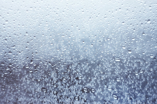 window glass in drops of rain in cloudy weather © Valeri Vatel