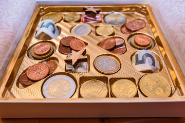A great idea how to pack money as a gift in a candy box.