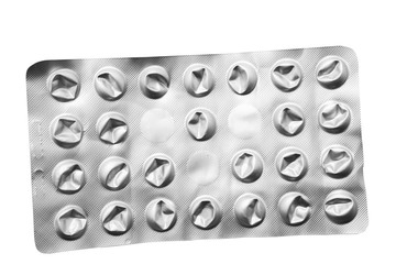 Used metal pack of pills isolated on white background
