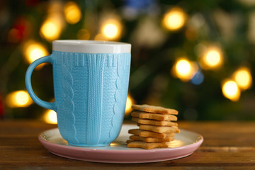 blue mug with hot chocolate and ginger cookies